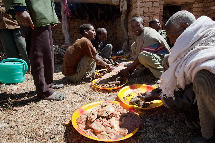 106   A cow is slaughtered and prepared for a local orthodox celebration (near Yohannes Maequddi Rock hewn church)  Ethiopia 